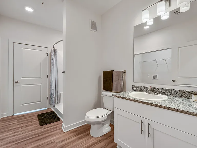 Bathroom with sink, toilet and walk in shower