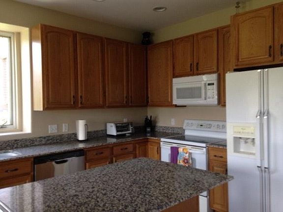 Kitchen with large island and prep sink