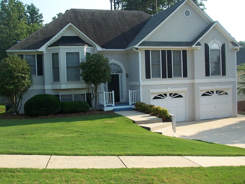Sidewalk & fenced yard with playset