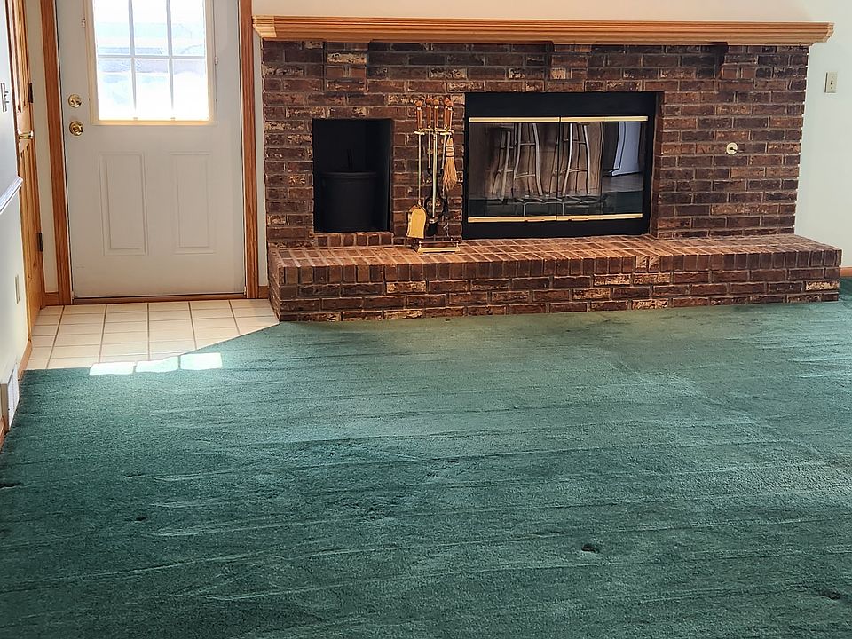 wood burning fireplace. exterior door to deck