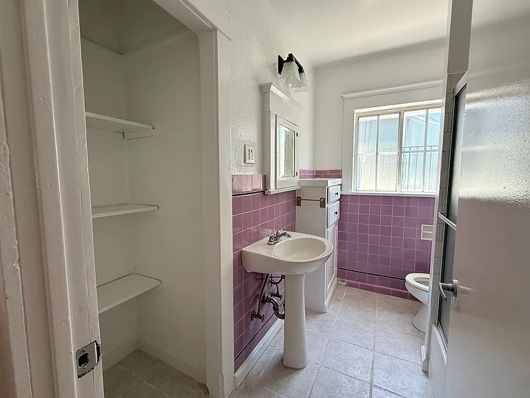 Main bathroom with purple tile.