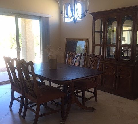 Formal dining room adjacent to patio doors.