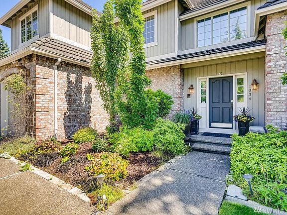 Mature landscaping greets you throughout the home