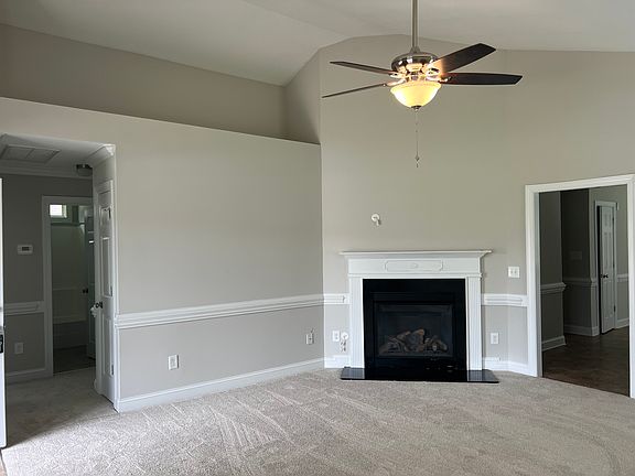 Living Room with new carpet and insert fireplace!