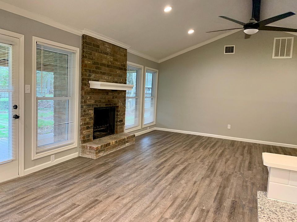 Bright, spacious living room with a fireplace
