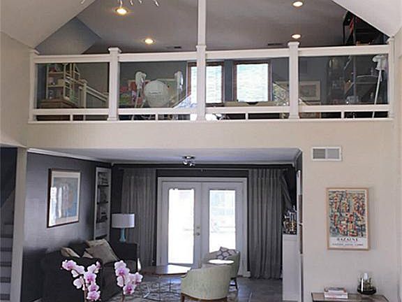 Upstairs Gameroom with a Living room view.
