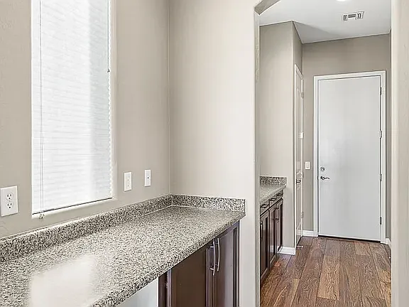 Entry for utility rm, pantry, two car garage, extra storage cabinets, coat closet