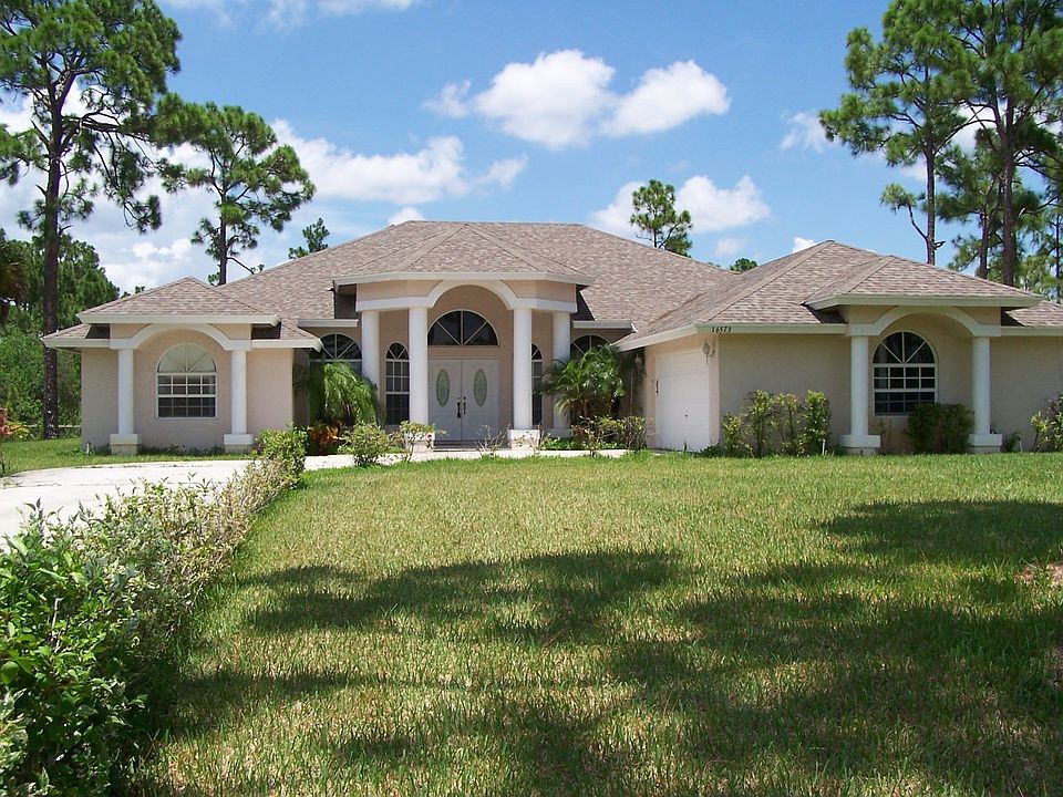 Exterior Front View Nice lot, fully fenced, shade trees.