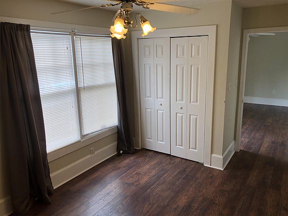 Bedroom with new flooring and ample closet space