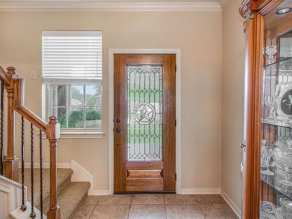 Front foyer and beautiful entree door.