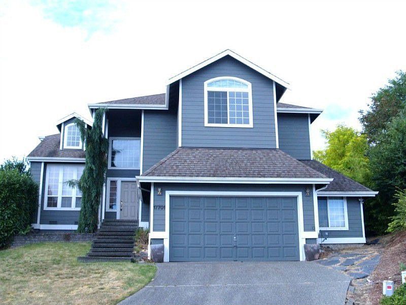 Large home sitting high above the neighbors overlooking the valley with views of the mountains.