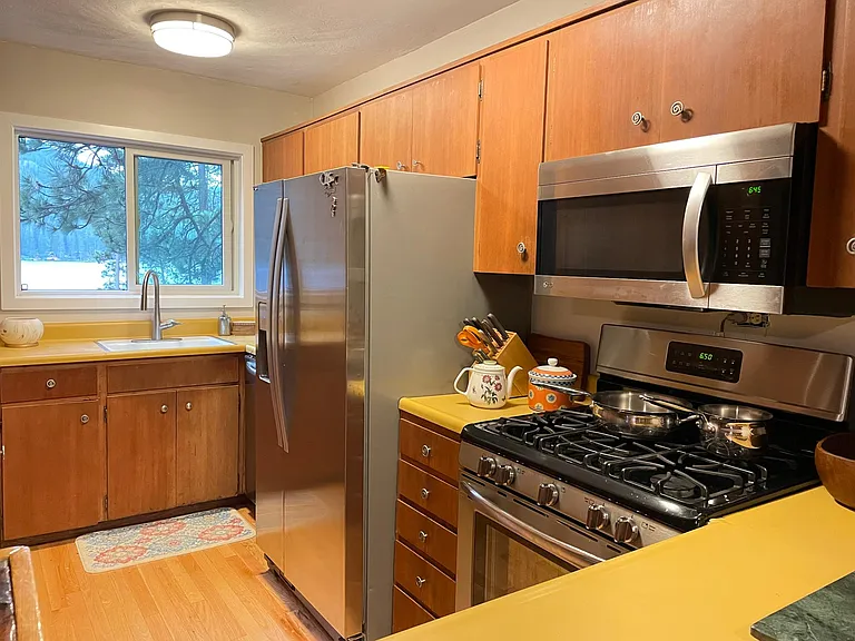 kitchen with lake view. Who wouldn't want to do the dishes? Gas stove.