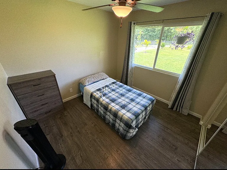 second bedroom w bed and dresser