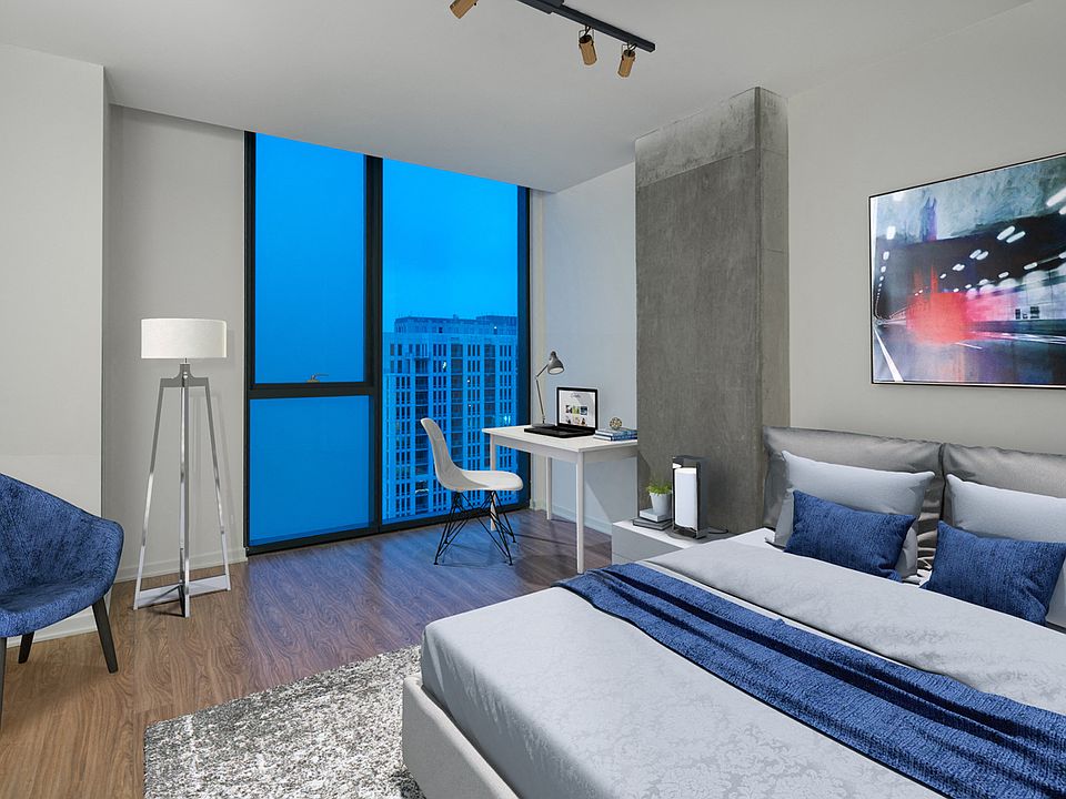 Floor-to-ceiling views from your penthouse bedroom
