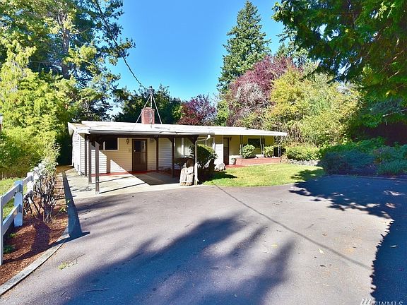 Front of residence with carport.