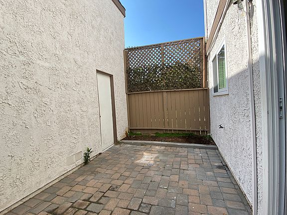 Private yard area between garage and the building
