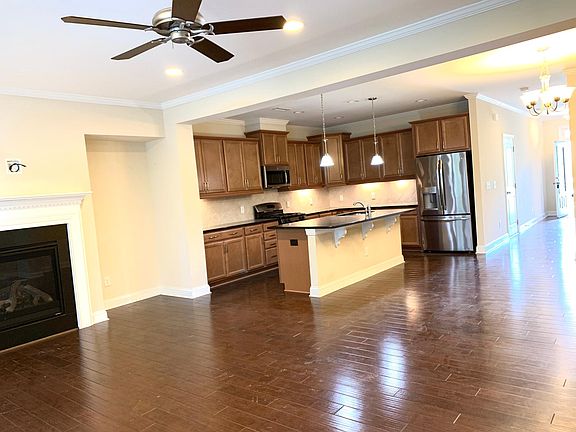 Family room with ceiling fan.