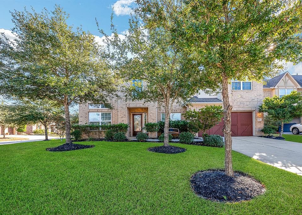 Great curb appeal with beautiful trees!