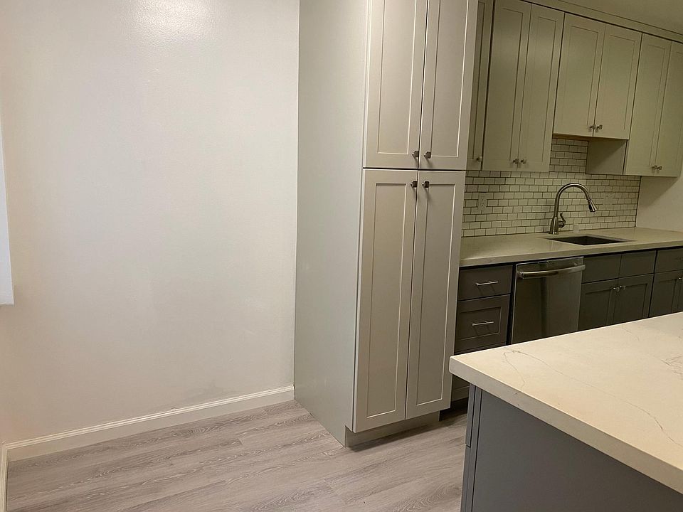 Kitchen deep sink, dishwasher, lots of cabinets for storage, seating area