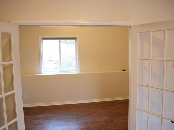 French doors into bedroom.