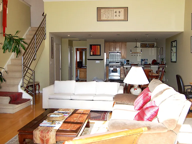 Expansive living area- one of the original lofts built with massive square footage. Upstairs bedroom loft with balcony overlooking downstairs area and towards windows.