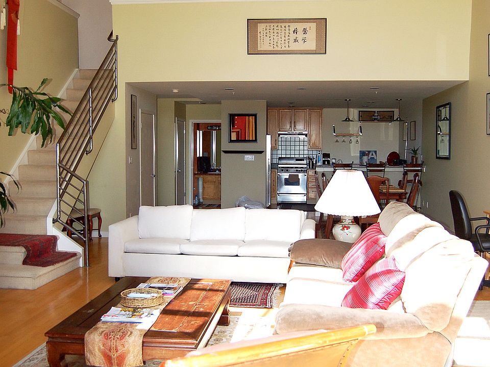 Expansive living area- one of the original lofts built with massive square footage. Upstairs bedroom loft with balcony overlooking downstairs area and towards windows.