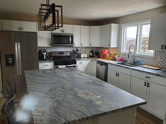 Brand new cabinets, stainless steel appliances, granite countertops and tile backsplash.