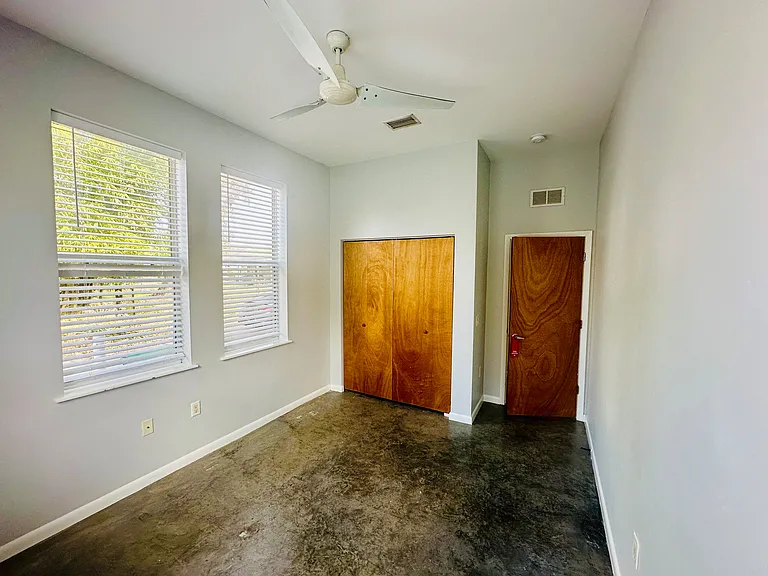 Downstairs Bedroom with closet. Comes with blinds.