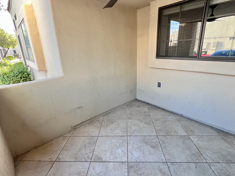 Patio with new ceiling fan and screen door July 2026