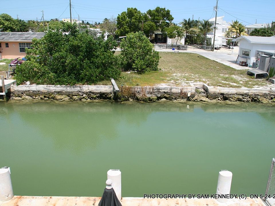 lot view from across canal (trees have been removed)