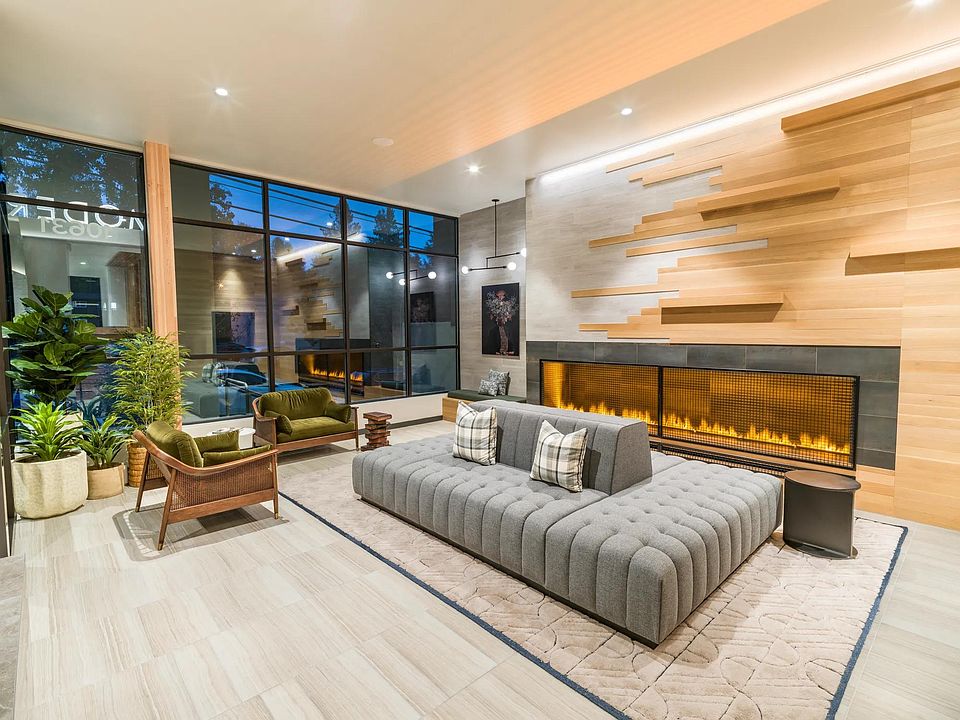 Feel instantly at home in Modera Northgate's hotel-inspired lobby, where a cozy fireplace and sophisticated design create a warm, inviting atmosphere.