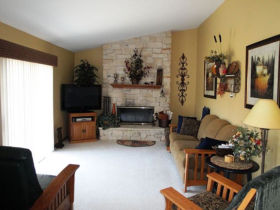 Family room w/ floor to ceiling natural fire place