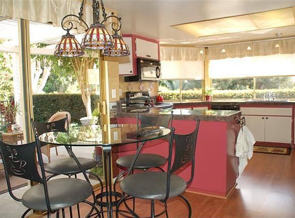 Eat-in Kitchen leads to side patio.