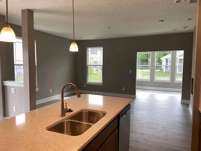 Kitchen look out to Family room and Sun room