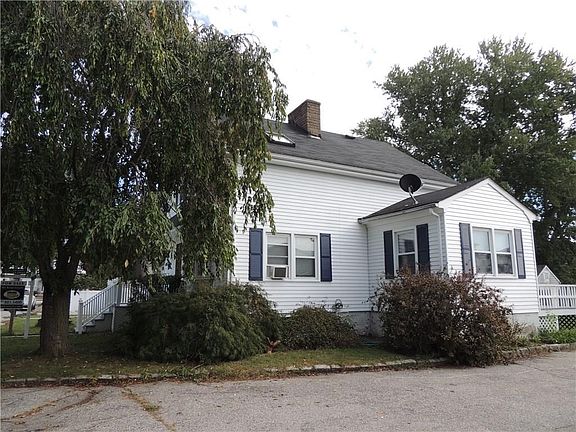 Exterior front driveway side with access to detached garage, back door, back deck and HUGE backyard