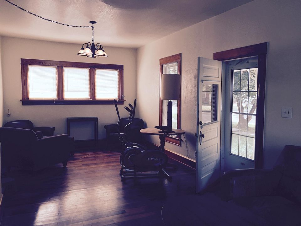 Living room with door to front porch