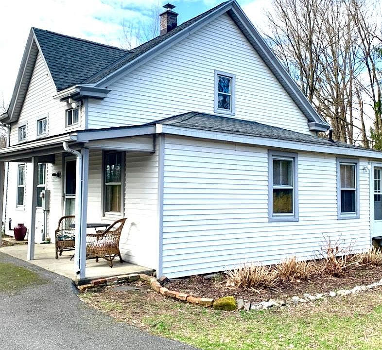 Front and east side of house.