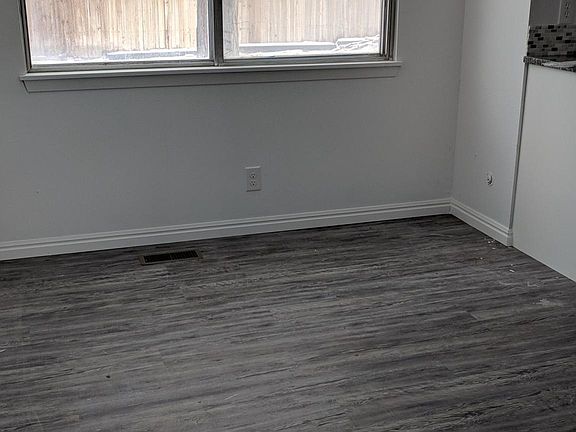 Dining room from side entrance with vertical blinds
