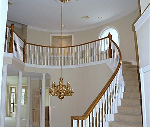 Amazing wrap around stairway in the entry