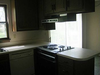 Kitchen has lots of cupboards!  DW, electric stoveoven.