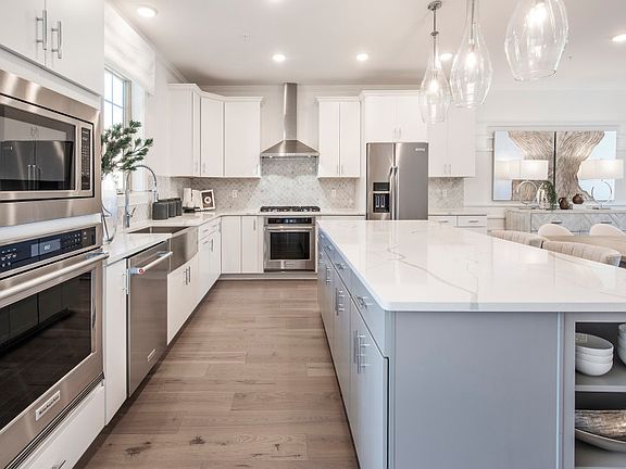 Rear kitchen with oversized countertop for extra seating