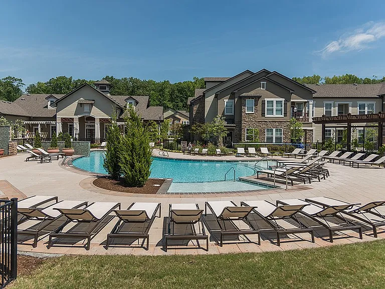 Sparkling Pool with Chaise Lounge Chairs