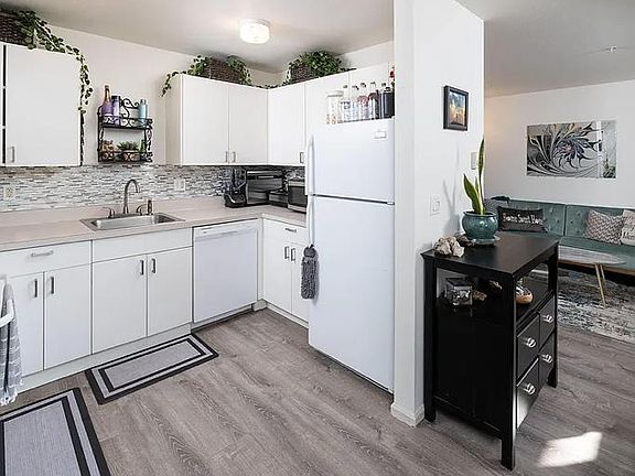 kitchen with all new plank flooring lovey new backsplash tile. Has been owner occupied so beautifully kept.