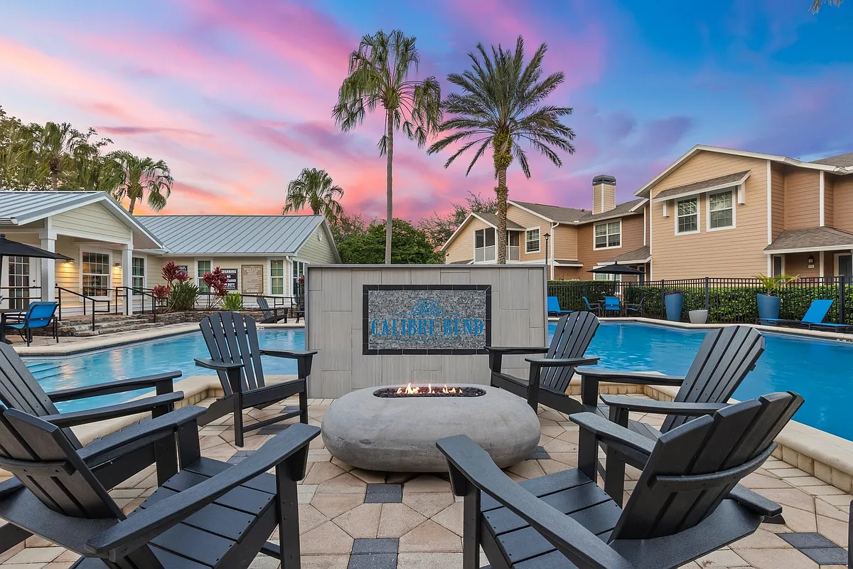 Poolside Fit Pit with Adirondack Chairs - Calibre Bend Apartments