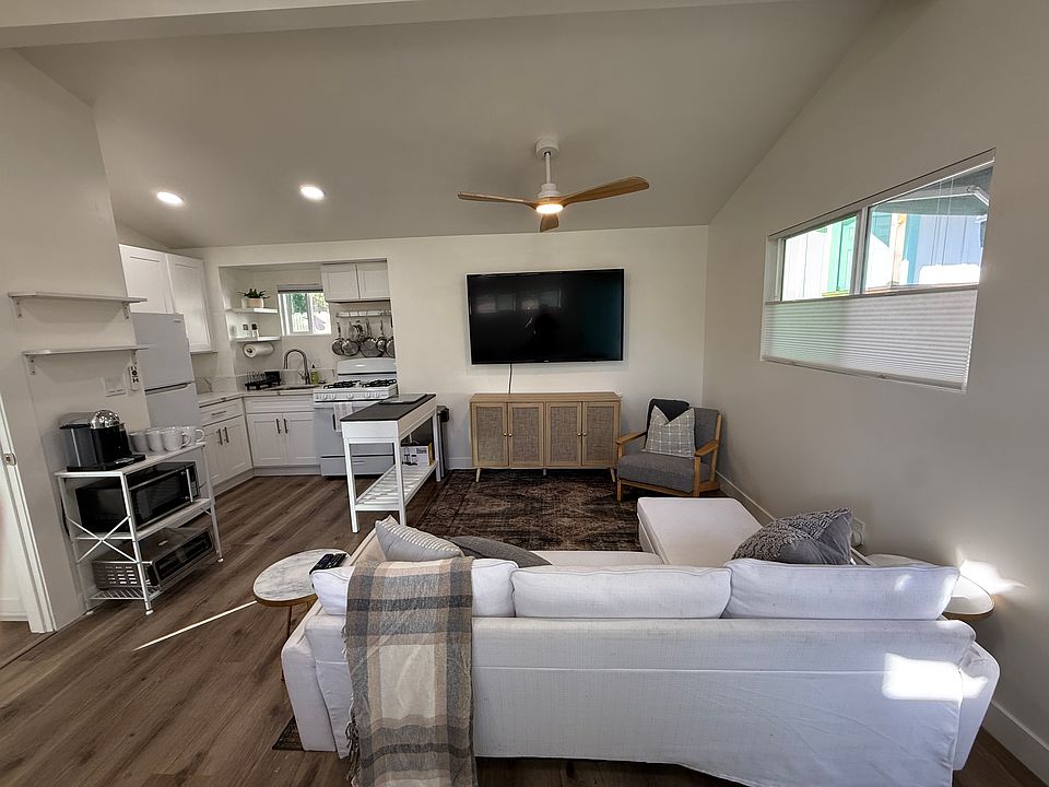 Open plan living room with vaulted ceilings and tons of natural light.