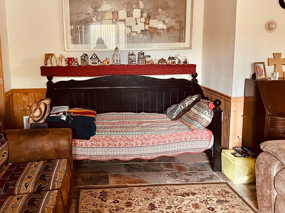 The den is furnished with 2 nice couches, 1- a hide-away bed, and this daybed.