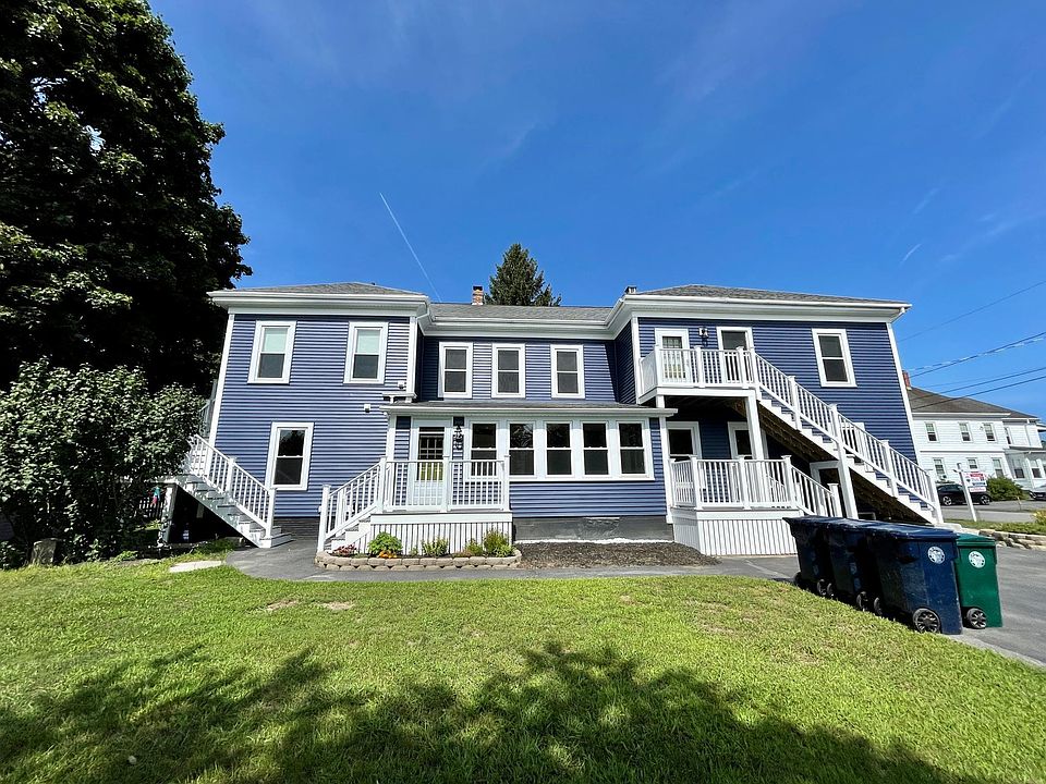 Front of house. The porch and entrance to this unit are on the bottom left. All composite decking and vinyl railings.