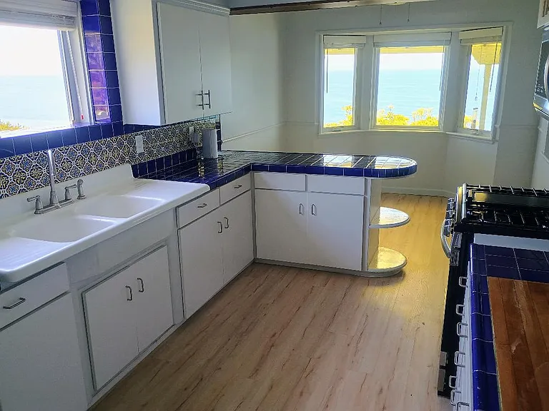 Kitchen With Dining Room In Background