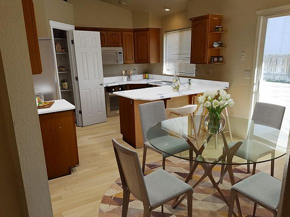 Large Kitchen and eating area with slider door to the backyard for BBQ.