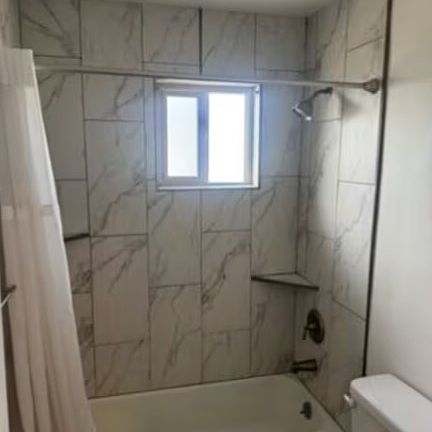 Bathroom with a shower tub.